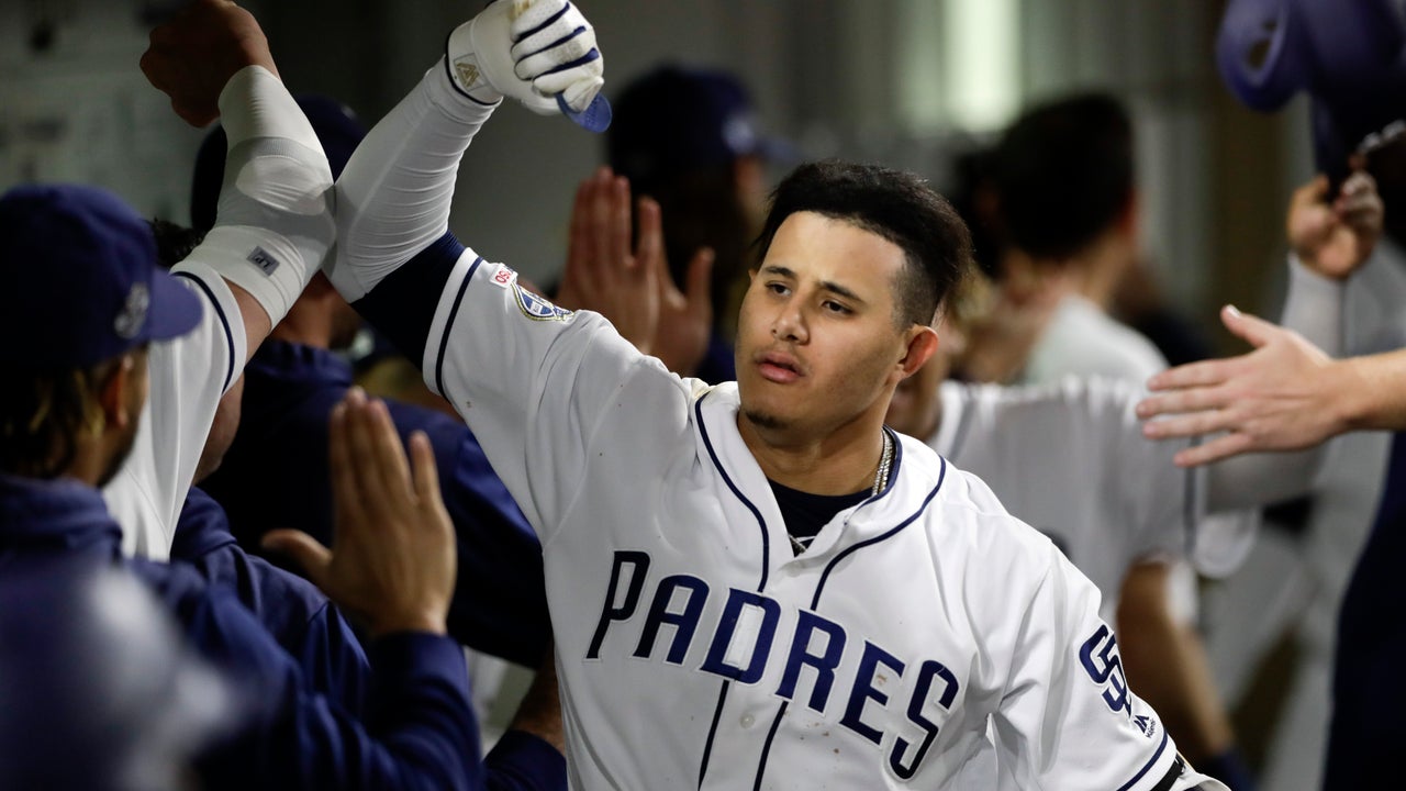 Machado’s grand slam carries Padres over Harper’s Phillies